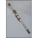 A 20th century Chinese decorative miniature sword letter opener paper knife. Having a brass