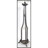 A Victorian oak tall cylindrical tapering stick stand / hallstand having peripheral stretchers and