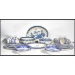 An extensive Booths Old Willow Ware blue and white ceramic dinner service consisting of plates ,