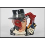 A Royal Doulton character jug depicting The Phantom of the Opera D7017 , handle modelled after a