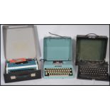 A group of three retro / vintage cased typewriters to include an Underwood 315, the  Imperial Good