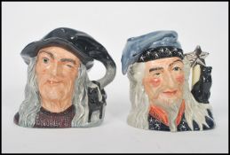 Two A Royal Doulton Character Jugs : The Wizard D6862 and The Witch D6893. Measures 18cm high. Note;