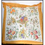 GUCCI, a silk scarf by Vittorio Accornero, with flora and fauna design, orange border measuring 85 x