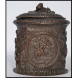 An 19th century Georgian tobacco pot jar. The table top box depicting classical scenes of battle