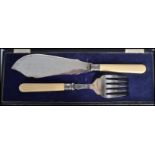 A vintage 20th century Edwardian cased two piece fish serving utensils with ivorine handles and