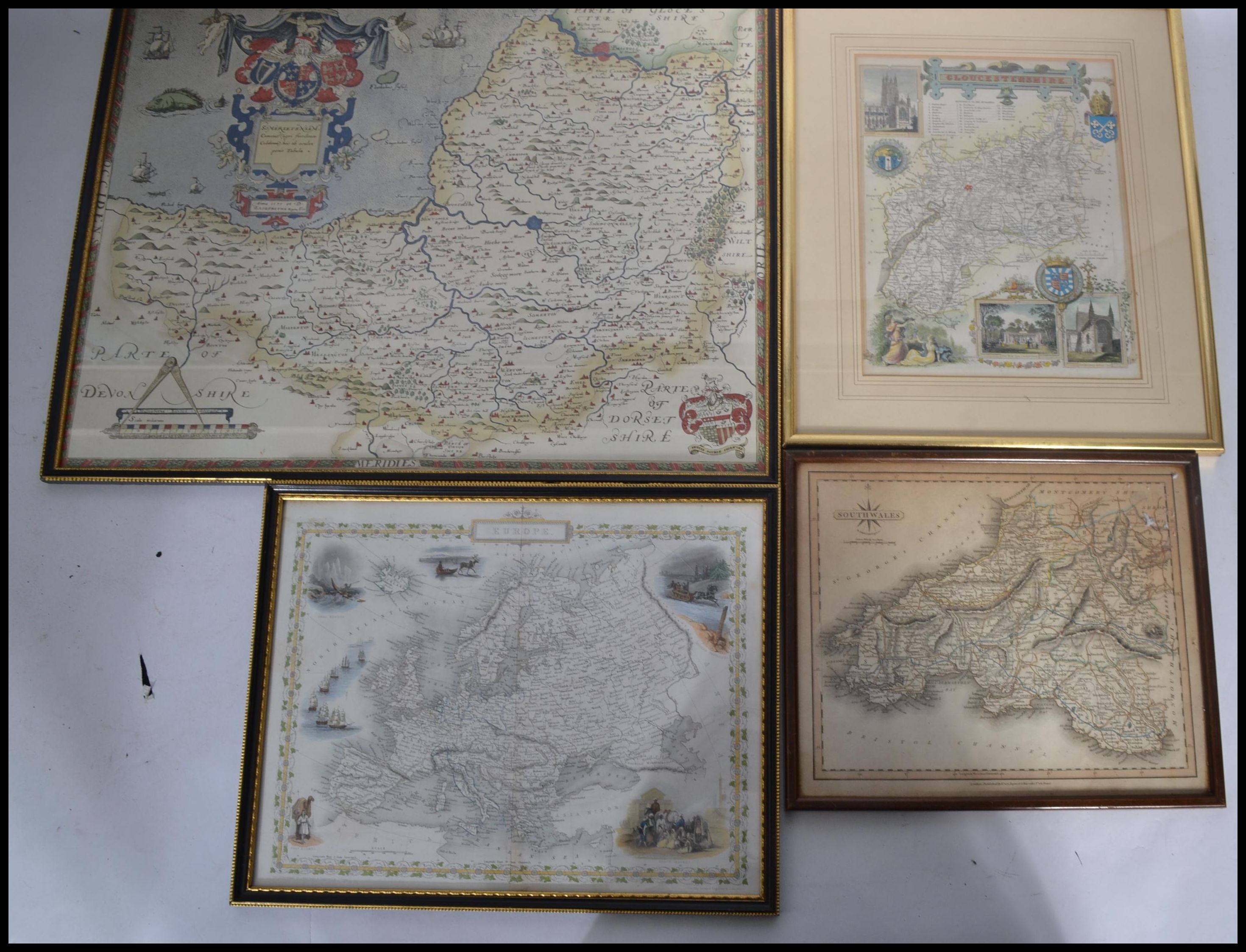 A collection of four framed and glazed 19th and 20th century maps to include a map of Europe drawn