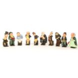 A group of ten Royal Doulton Dickensian figurines to include Fagin , Pecksniff , The Artful Dodger ,