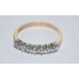 A hallmarked 9ct 7 stone gold ring set with 7 white stones.   Hallmarked  Sheffield. Size R.  Weight
