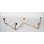 A vintage retro 20th century sputnik atomic set of coat hooks in a painted finish with multi