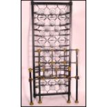A Victorian ebonised cast iron single bed frame. The head and foot with gilded finials and caubels