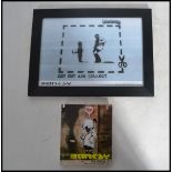 A framed and glazed Banksy Bristol street artist print Cut Out and Collect 6/50 along with Banksy