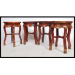 A set of four 20th century Chinese oriental stools