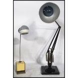 A 1940's Industrial pre-war Herbert Terry anglepoise lamp, raised on a cast metal two step base with