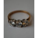A hallmarked 9ct 3 stone gold ring set with 3 white stones. Hallmarked Sheffield. Size M. Weight 2.