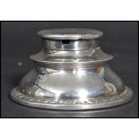 An early 20th century silver hallmarked Edwardian inkwell of stepped circular form. Hallmarked dor