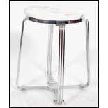 A vintage retro 20th century industrial chrome stool of tubular form having a white marble seat.
