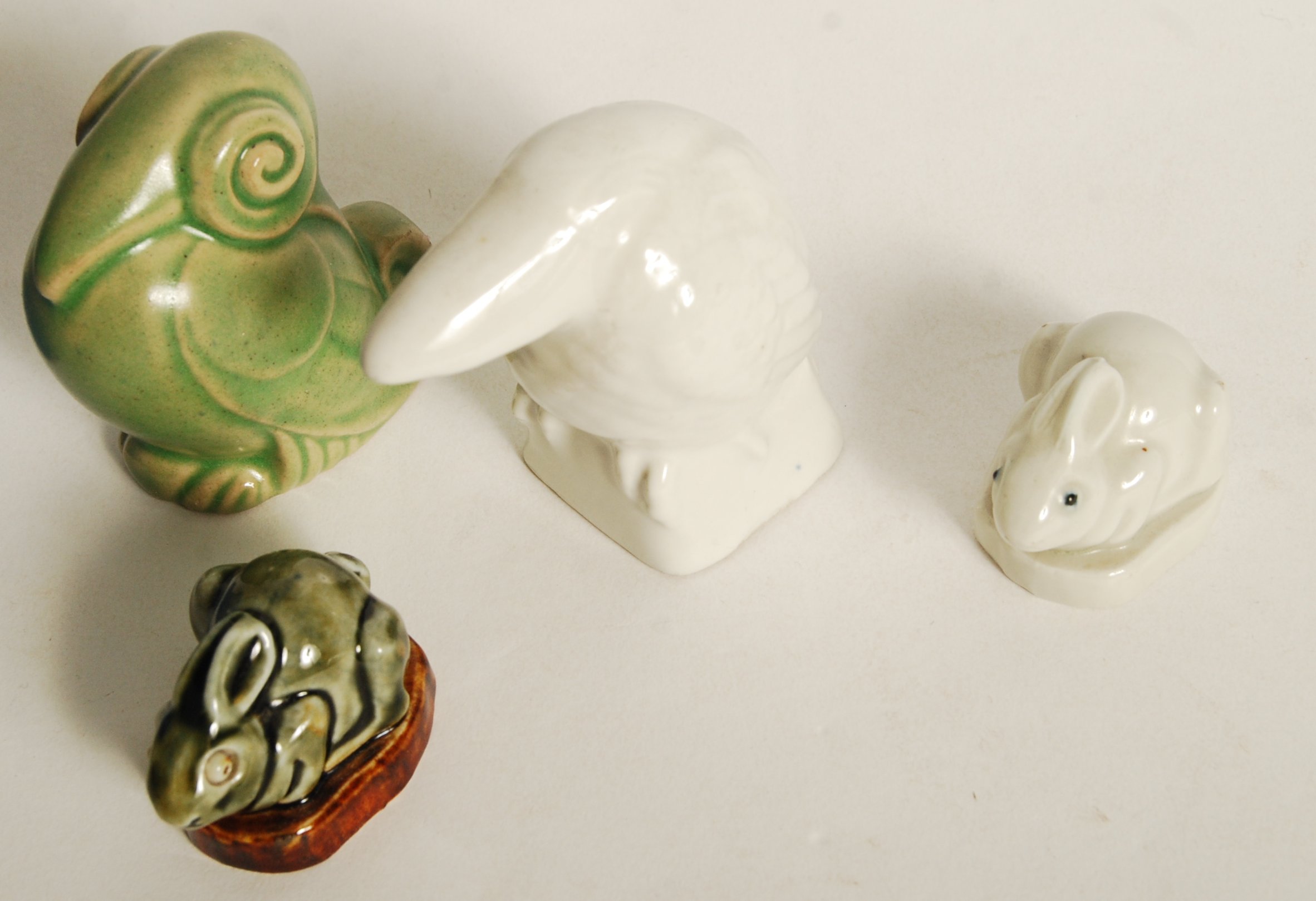 A group of Royal Doulton animals to include a pair of blue and green glazed scrolled birds , a plain - Image 3 of 4