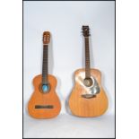 A vintage 20th century Yamaha F310 six string guitar along with a Clasico Spanish six string guitar.