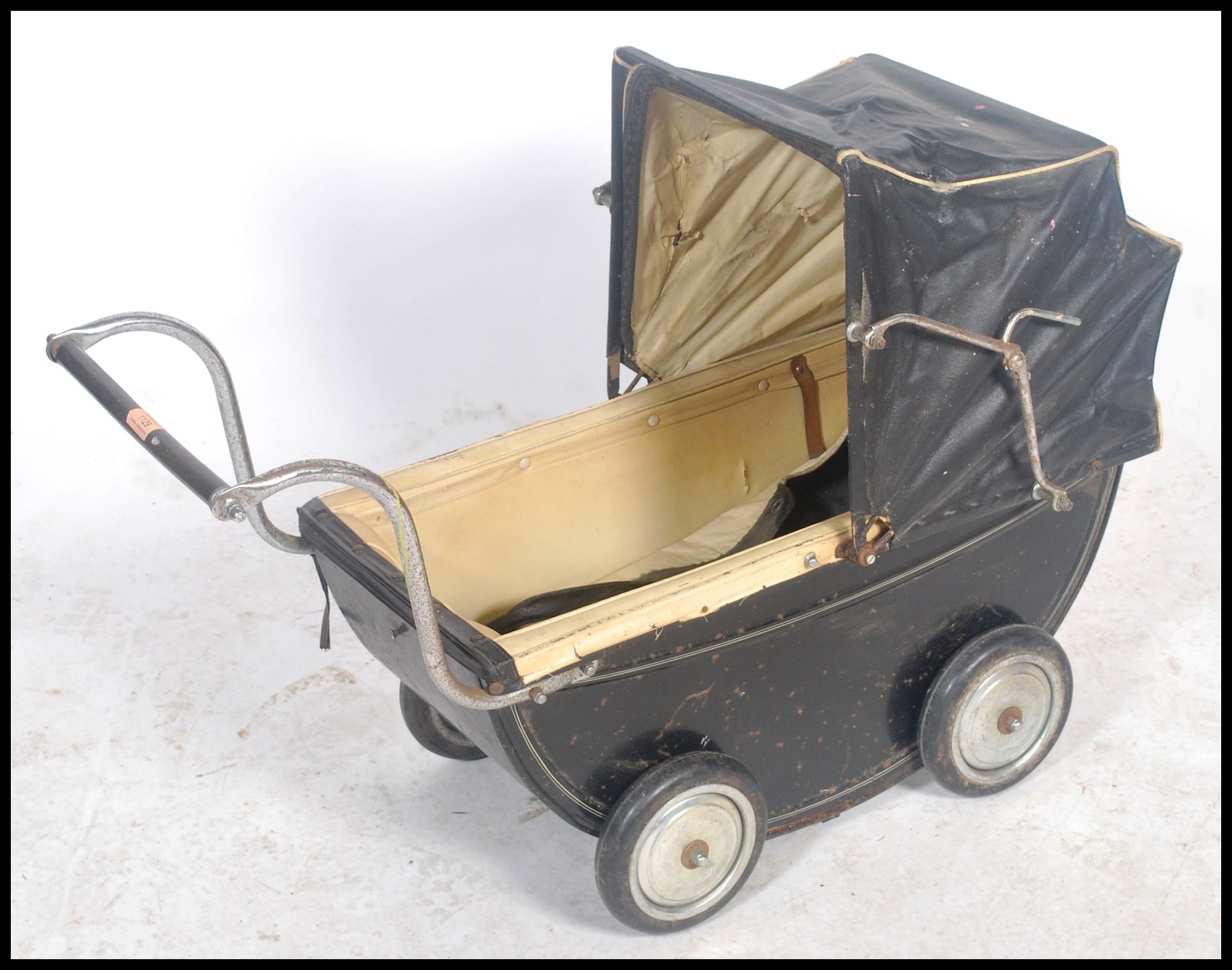 A vintage 20th century childs enamel painted pram in black with the original spoked wheels. The - Image 2 of 4