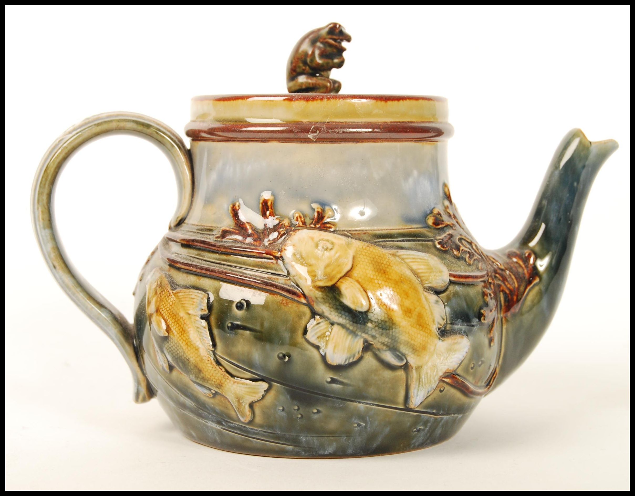 A Royal Doulton stoneware teapot and cover, the design attributed to George Tinworth, the body - Image 2 of 4