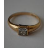 A hallmarked 9ct gold ring set with a cushion cut white stone.  Hallmarked London. Size  Q.5. Weight