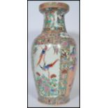 A large Chinese 20th century famille rose pattern vase of baluster form having geometric floral