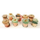 A group of seven Royal Doulton character jugs ashtrays along with two character jug table