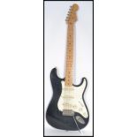 A Fender Squire Stratocaster electric six string guitar with blue body white scratch plate. Measures