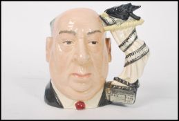 A Royal Doulton large character jug Alfred Hitchcock D6987. The handle modelled as a curtain and