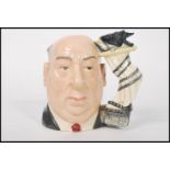 A Royal Doulton large character jug Alfred Hitchcock D6987. The handle modelled as a curtain and