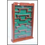 A 20th century good quality Chinese Hardwood Wall Hanging Collectors Display Cabinet with Fitted