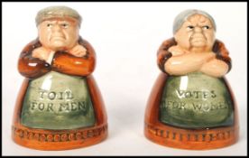 A pair of Royal Doulton salt and pepper pots entitled 'Votes for Women' and 'Toil for Men', D7066