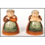 A pair of Royal Doulton salt and pepper pots entitled 'Votes for Women' and 'Toil for Men', D7066