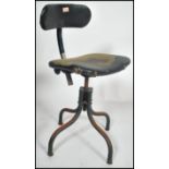 A retro mid century Tansad Industrial office - clerks swivel chair. Raised on a tubular metal base