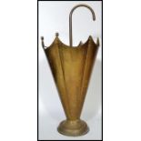 An early 20th century brass stick stand in the form of an upturned umbrella. 62cm tall.