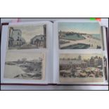 Postcards; an album of assorted vintage postcards, largely views of seaside towns / villages. Many