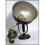 A vintage mid century industrial black spot desk lamp on terraced base with large pendant shade in