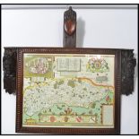 A 19th century carved black forest oak picture / map frame with carved Flemish oak mask mounts