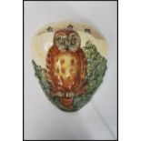 A Royal Doulton owl wall pocket / font depicting an owl in with a crescent moon having three stars