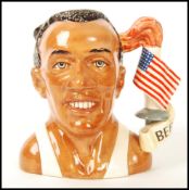 A Royal Doulton Large Character Jug Jesse Owens D7019, Jug of the Year 1996. Measures 18cms high.