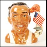 A Royal Doulton Large Character Jug Jesse Owens D7019, Jug of the Year 1996. Measures 18cms high.