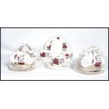 A vintage mid 20th century Colclough 12 person tea service in a floral pattern consisting of cups