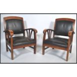 A pair of French art deco style solid hadrwood carver fireside armchairs having a square backrest