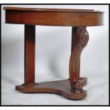 A Victorian mahogany Duchess console table being raised on shaped front support with lower tier on