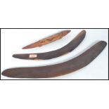 Two vintage 20th century Australian Aboriginal boomerangs with a small carving of a lizard. Please