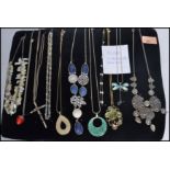 A group of 9 silver and costume jewellery necklaces to include mother of pearl , tribal ,