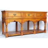 An excellent large  oak country dresser base of impressive size being raised on turned bulbous