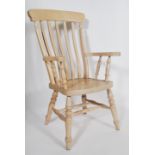 A Victorian style 20th century light beech wood windsor armchair - chair. Raised on turned legs