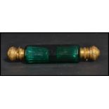 A 19th century Victorian faceted green glass double ended perfume bottle with hinged gilt metal