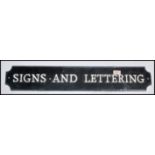 A vintage 20th century metal wall / advertising sign with notation ' Signs & Lettering ' Black